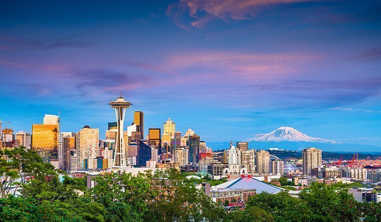 Seattle, Washington, USA Skyline Seattle, Washington, USA downtown skyline at night with Mt. Rainier.